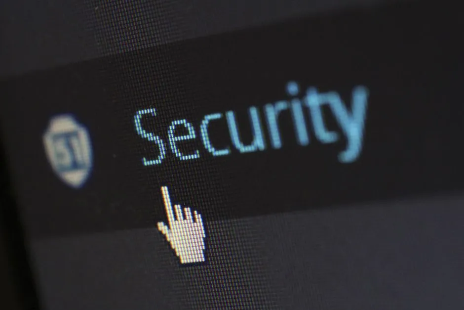 A mouse cursor hovering over digital security text on a screen